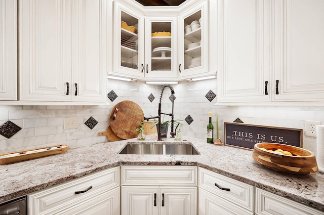 519 Greenup St Unit A, Covington, KY 41011 - kitchen featuring a sink, glass insert cabinets, white cabinetry, and tasteful backsplash