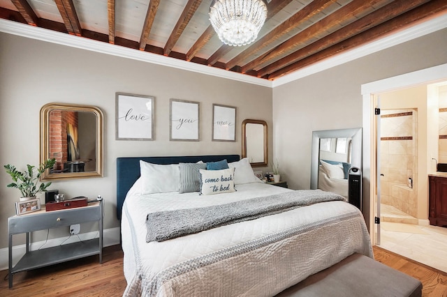 519 Greenup St Unit A, Covington, KY 41011 - bedroom with a chandelier, wood finished floors, connected bathroom, beam ceiling, and ornamental molding