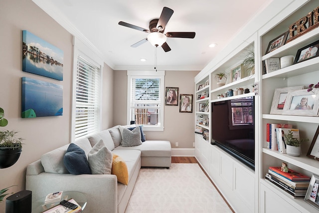 519 Greenup St Unit A, Covington, KY 41011 - living area with crown molding, light wood-type flooring, ceiling fan, baseboards, and built in shelves