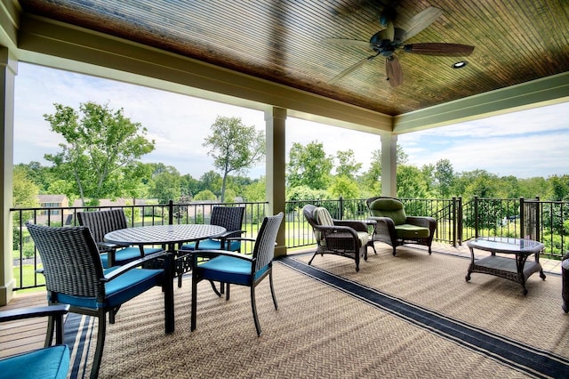 3257 Ivy Ridge Dr, Taylor Mill, KY 41015 - wooden terrace with ceiling fan, view of scattered trees, and outdoor dining area