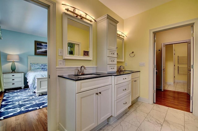 3257 Ivy Ridge Dr, Taylor Mill, KY 41015 - full bath with double vanity, ensuite bathroom, marble look tiles, and baseboards