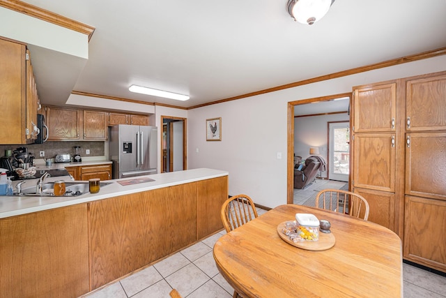 8 Whispering Woods Ln, Alexandria, KY 41001 - kitchen with high end refrigerator, black microwave, light tile patterned flooring, a peninsula, and crown molding