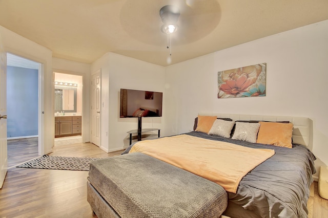 370 Timber Ridge Dr Unit 3, Wilder, KY 41071 - bedroom with light wood-style flooring, baseboards, ensuite bathroom, a ceiling fan, and a sink