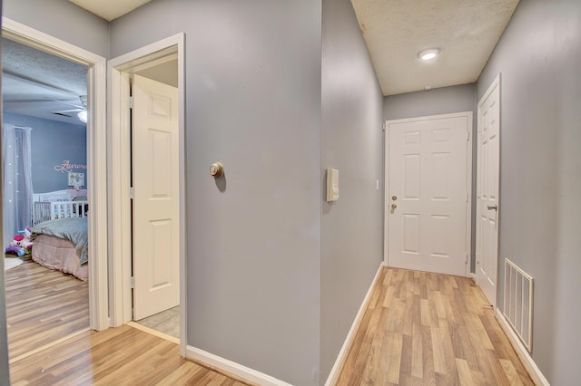 370 Timber Ridge Dr Unit 3, Wilder, KY 41071 - hall with light wood-style floors, baseboards, and a textured ceiling