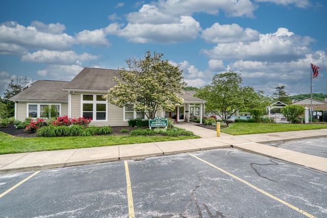 370 Timber Ridge Dr Unit 3, Wilder, KY 41071 - view of front of home featuring uncovered parking, a front yard, and a shingled roof