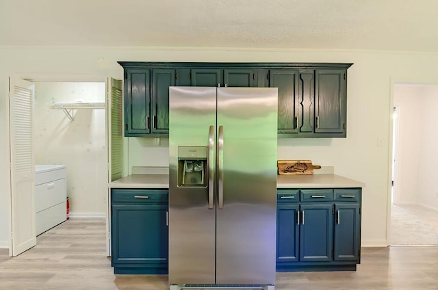 6740 Wisdom Dock Rd, Albany, KY 42602 - kitchen with stainless steel fridge, light wood-style floors, light countertops, and washer / dryer