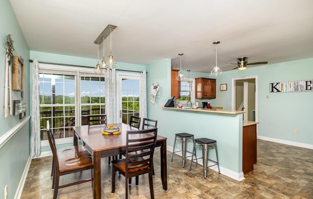 14492 Stephenson Rd, Morning View, KY 41063 - dining area featuring stone finish flooring, baseboards, and ceiling fan