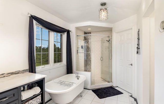 14492 Stephenson Rd, Morning View, KY 41063 - full bathroom featuring a shower stall, a freestanding tub, and tile patterned flooring