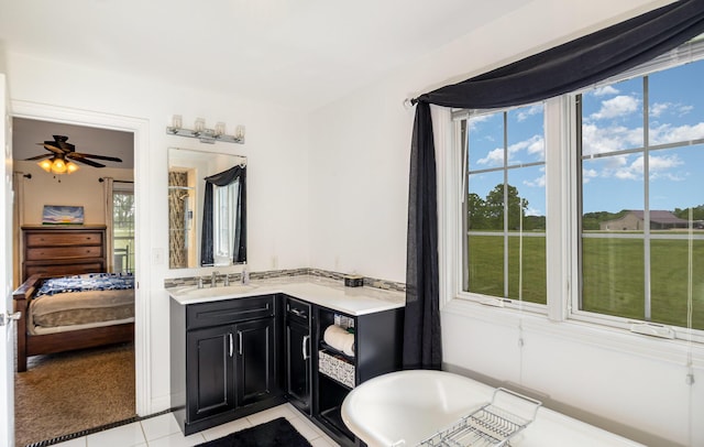 14492 Stephenson Rd, Morning View, KY 41063 - full bathroom with a freestanding bath, ensuite bath, tile patterned floors, vanity, and a ceiling fan