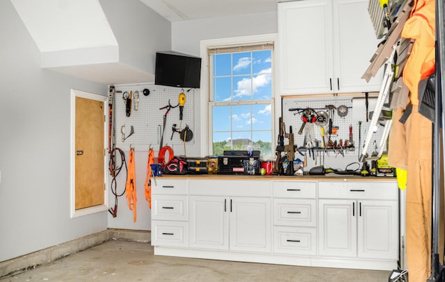 14492 Stephenson Rd, Morning View, KY 41063 - kitchen featuring white cabinetry and concrete floors