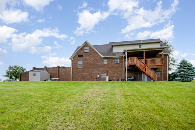 14492 Stephenson Rd, Morning View, KY 41063 - rear view of house featuring stairway, a wooden deck, a yard, and brick siding