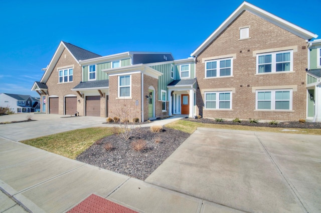 2422 Arezzo St, Covington, KY 41017 - view of property featuring brick siding, concrete driveway, and an attached garage