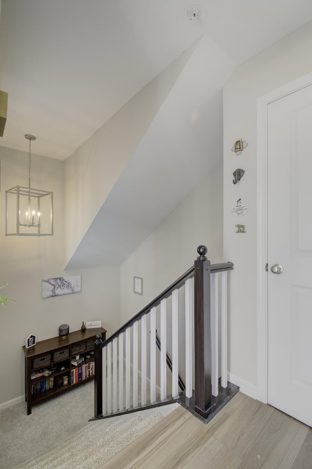 2422 Arezzo St, Covington, KY 41017 - stairway with a chandelier, baseboards, and wood finished floors