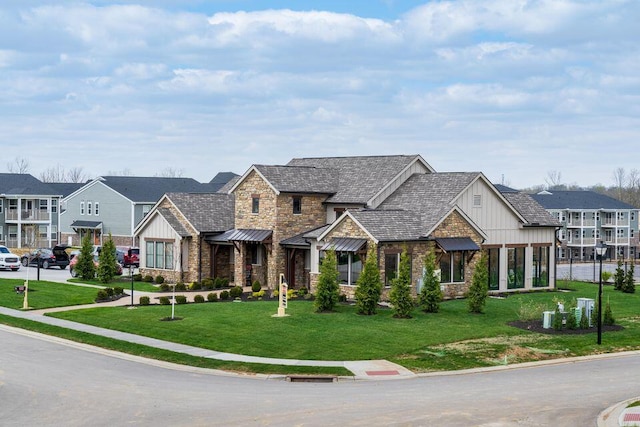 2422 Arezzo St, Covington, KY 41017 - view of front of property with stone siding, board and batten siding, a front lawn, a residential view, and a standing seam roof