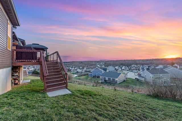 10988 Dairybarn Ln, Alexandria, KY 41001 - yard at dusk featuring stairway, a deck, a residential view, and a lawn