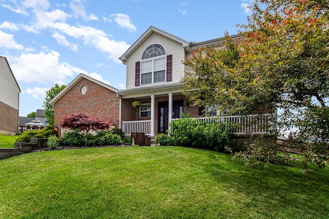 1051 Apple Blossom Dr, Florence, KY 41042 - view of front facade with brick siding, a porch, and a front yard