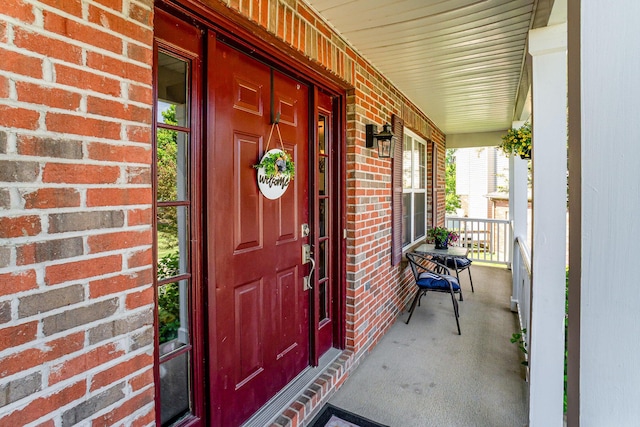 1051 Apple Blossom Dr, Florence, KY 41042 - doorway to property with a porch and brick siding