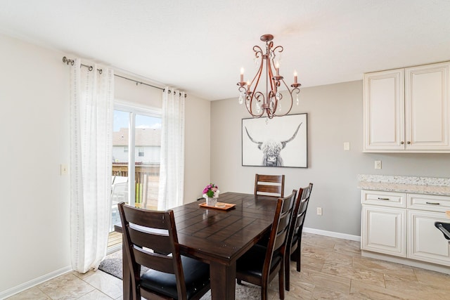 1051 Apple Blossom Dr, Florence, KY 41042 - dining area featuring a chandelier and baseboards