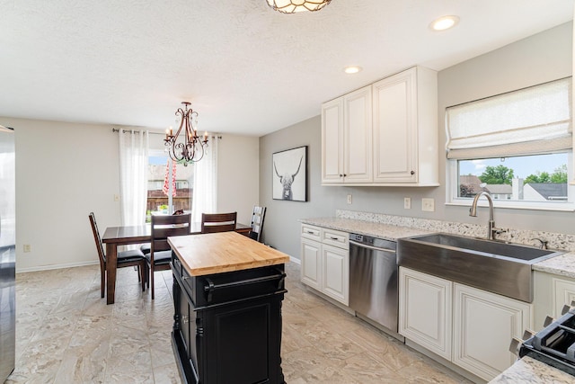 1051 Apple Blossom Dr, Florence, KY 41042 - kitchen featuring stainless steel dishwasher, healthy amount of natural light, a chandelier, butcher block countertops, and recessed lighting