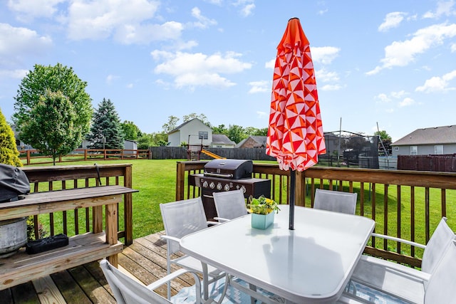 1051 Apple Blossom Dr, Florence, KY 41042 - wooden deck with a trampoline, outdoor dining area, and grilling area