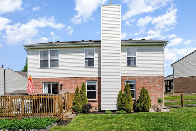 1051 Apple Blossom Dr, Florence, KY 41042 - rear view of house featuring brick siding, a chimney, a deck, and a lawn