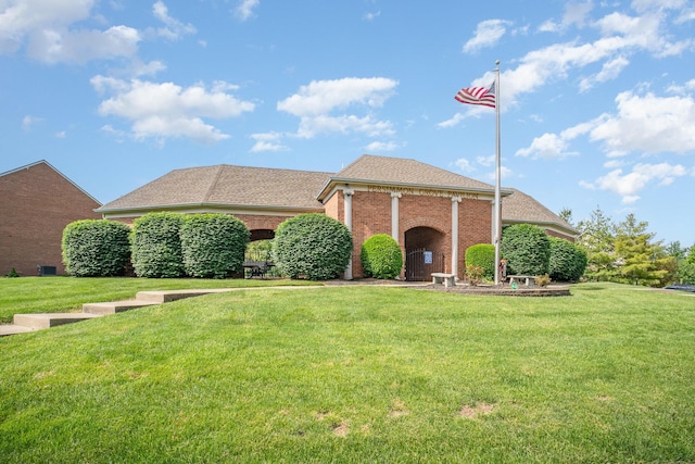 1051 Apple Blossom Dr, Florence, KY 41042 - greek revival house with brick siding, a front lawn, and roof with shingles
