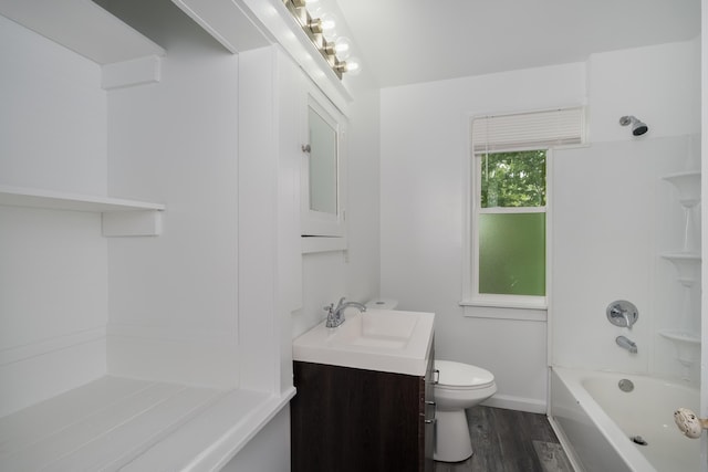 2789 Madison Ave, Covington, KY 41015 - bathroom featuring vanity, toilet, wood finished floors, bathtub / shower combination, and baseboards