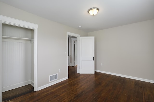 2789 Madison Ave, Covington, KY 41015 - unfurnished bedroom featuring baseboards, wood finished floors, and a closet