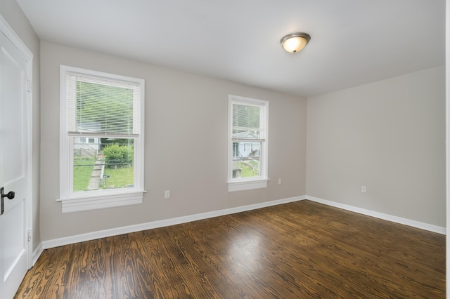 2789 Madison Ave, Covington, KY 41015 - spare room with healthy amount of natural light, dark wood-style flooring, and baseboards