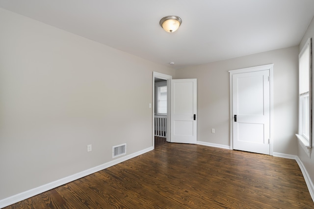 2789 Madison Ave, Covington, KY 41015 - unfurnished bedroom featuring baseboards and wood finished floors