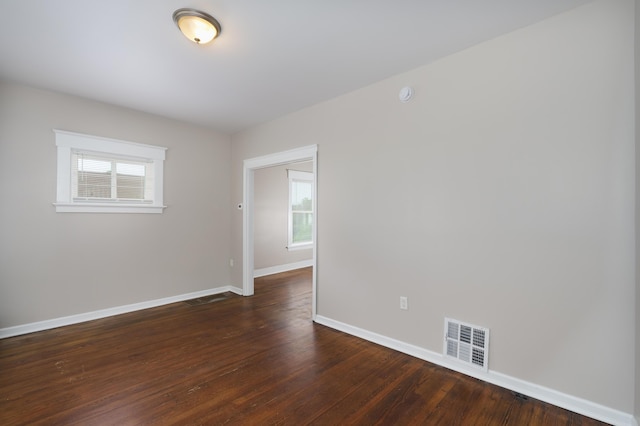 2789 Madison Ave, Covington, KY 41015 - spare room featuring healthy amount of natural light, baseboards, and dark wood finished floors