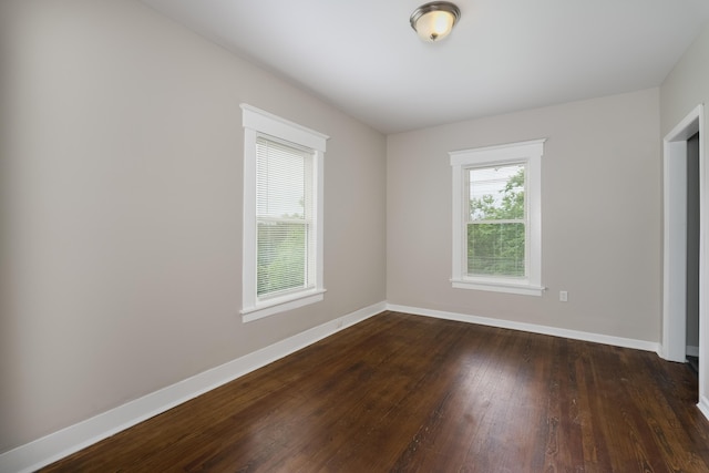 2789 Madison Ave, Covington, KY 41015 - unfurnished bedroom featuring baseboards and dark wood-style flooring