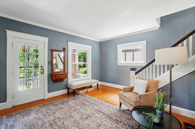 1126 Audubon Rd, Park Hills, KY 41011 - living area with wood finished floors, stairway, crown molding, and baseboards