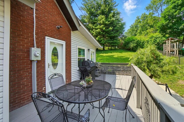 1126 Audubon Rd, Park Hills, KY 41011 - wooden deck with outdoor dining area, a grill, and a yard