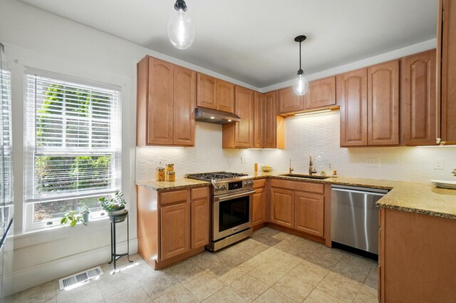 1126 Audubon Rd, Park Hills, KY 41011 - kitchen featuring stainless steel appliances, a sink, under cabinet range hood, and light stone countertops