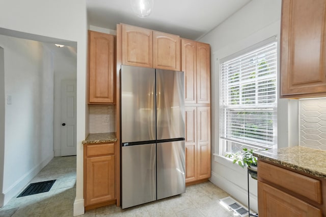1126 Audubon Rd, Park Hills, KY 41011 - kitchen featuring freestanding refrigerator, decorative backsplash, light stone counters, and healthy amount of natural light