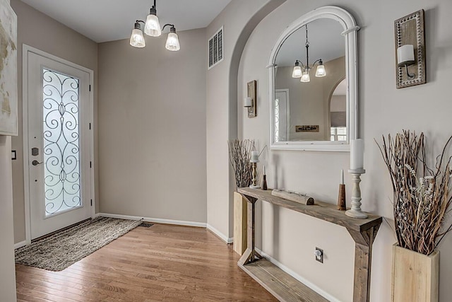 1514 Twinridge Way, Independence, KY 41051 - foyer featuring a chandelier, wood finished floors, arched walkways, and baseboards
