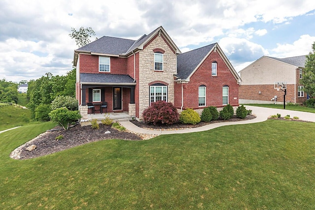 1514 Twinridge Way, Independence, KY 41051 - traditional-style house featuring a porch, brick siding, a front yard, and stone siding