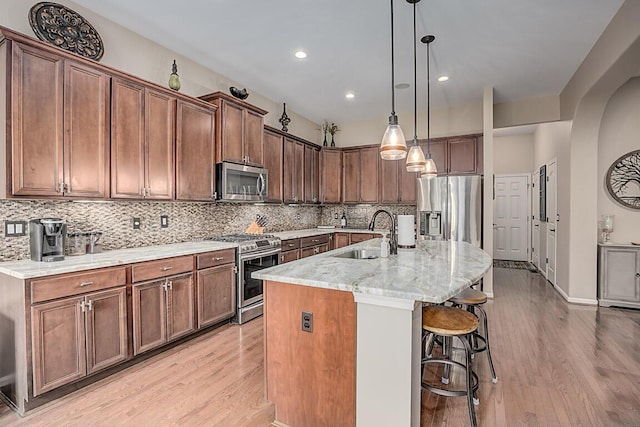 1514 Twinridge Way, Independence, KY 41051 - kitchen with appliances with stainless steel finishes, a sink, light wood finished floors, backsplash, and recessed lighting