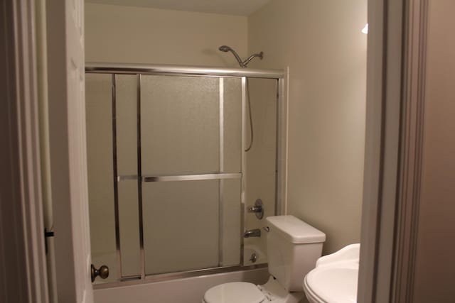 515 Telescope Vw Unit 103, Wilder, KY 41076 - full bathroom featuring toilet and bath / shower combo with glass door