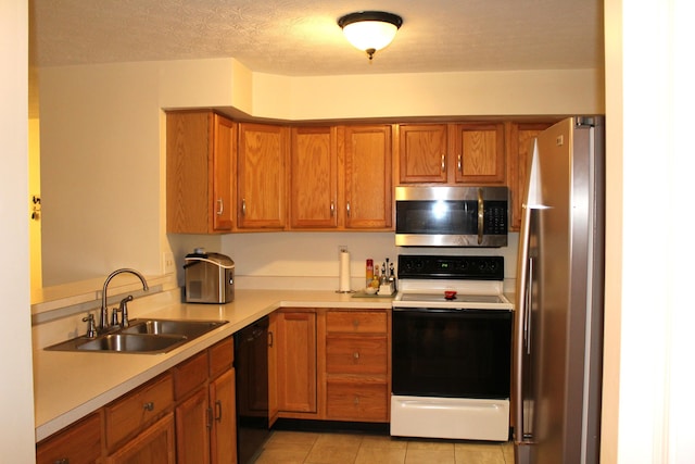 515 Telescope Vw Unit 103, Wilder, KY 41076 - kitchen with appliances with stainless steel finishes, a sink, brown cabinetry, and light countertops