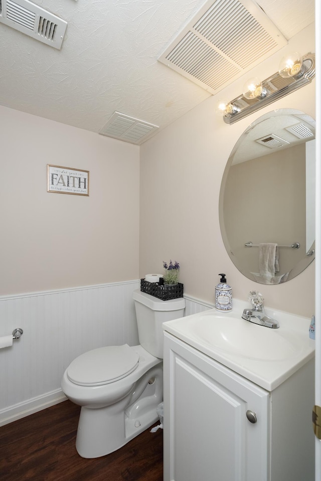 3350 Redbud Ct, Erlanger, KY 41018 - half bath featuring toilet, vanity, wood finished floors, and wainscoting