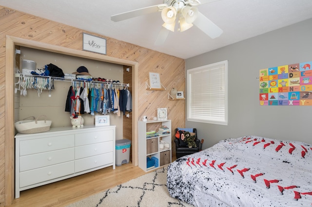3350 Redbud Ct, Erlanger, KY 41018 - bedroom with a closet, wood walls, wood finished floors, and ceiling fan