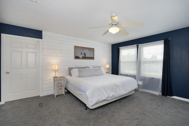 3350 Redbud Ct, Erlanger, KY 41018 - carpeted bedroom featuring ceiling fan and wooden walls