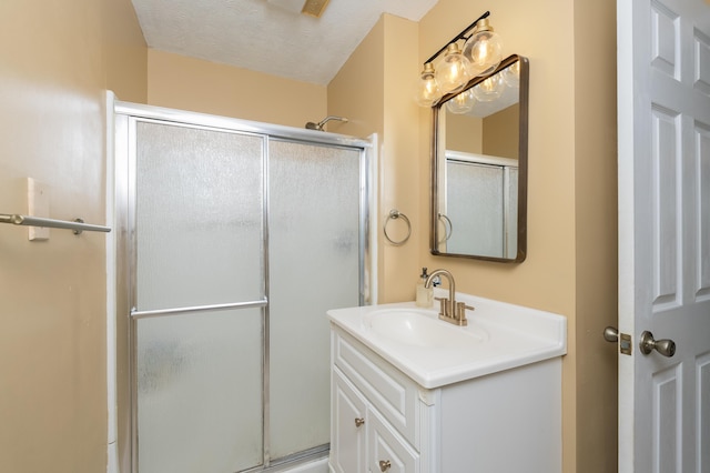3350 Redbud Ct, Erlanger, KY 41018 - bathroom featuring an enclosed shower, vanity, and a textured ceiling