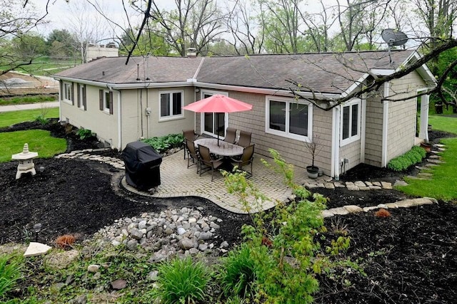 871 Bristow Rd, Independence, KY 41051 - back of house featuring roof with shingles, a patio area, and a chimney