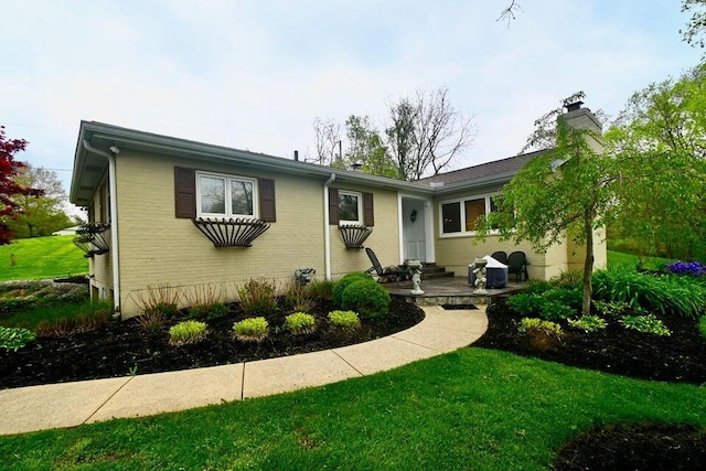 871 Bristow Rd, Independence, KY 41051 - ranch-style home featuring a chimney, brick siding, and a front yard