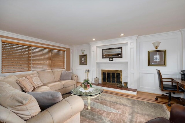 871 Bristow Rd, Independence, KY 41051 - living area featuring ornamental molding, wood finished floors, a decorative wall, and a brick fireplace