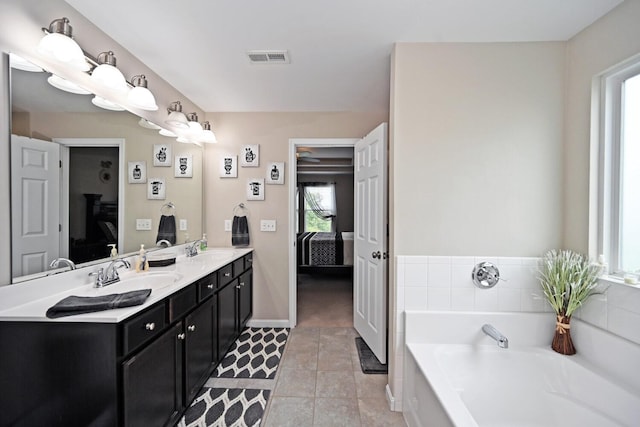 10113 Lapalco Ct, Union, KY 41091 - ensuite bathroom featuring plenty of natural light, a garden tub, double vanity, and baseboards