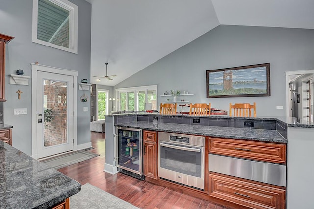 3270 Ballantree Way, Verona, KY 41092 - kitchen with beverage cooler, stainless steel oven, a warming drawer, dark wood-style flooring, and dark stone counters